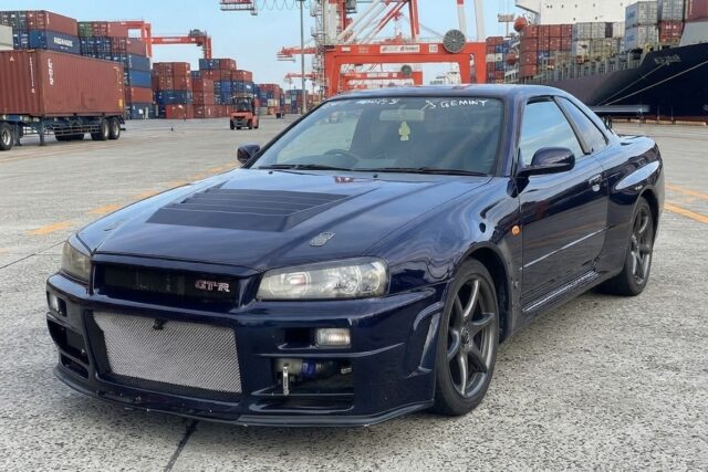 The Nissan Skyline GT-R R34 was produced from 1999 to 2002. This particular car, finished in the iconic Midnight Purple II (a color-shifting paint that appears deep blue or purple depending on the light), is one of only a few hundred examples produced in this specific shade, making it highly desirable from the moment it left the factory.